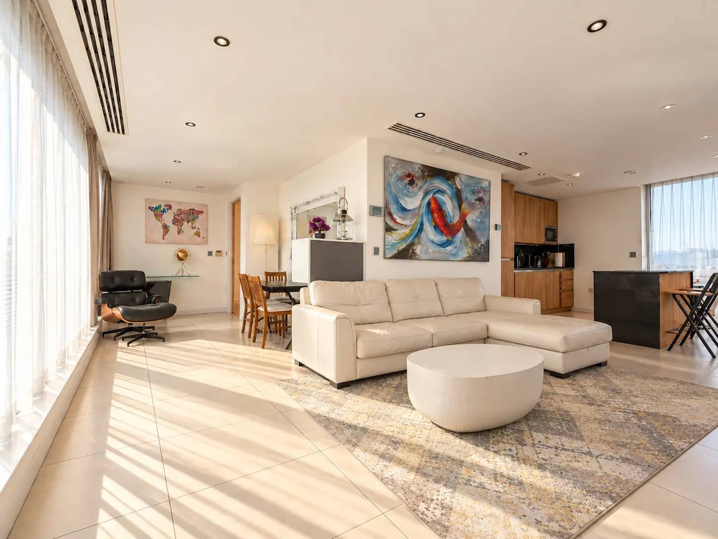 Bright open-plan lounge and dining area in the two-bedroom penthouse